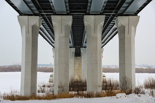 Four road bridge props close-up in winter