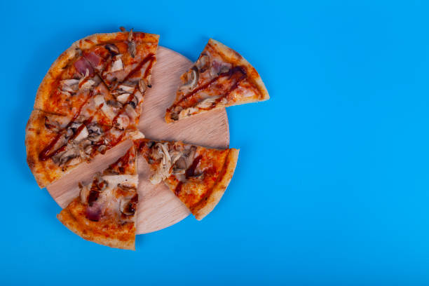 istock Delicious pizza cut into pieces 1362719858