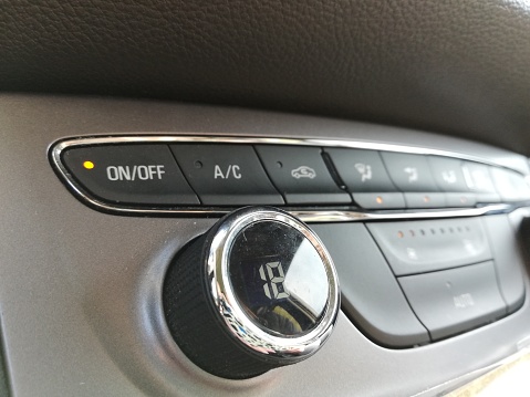 The air conditioning control dashboard inside car digital and manual buttons