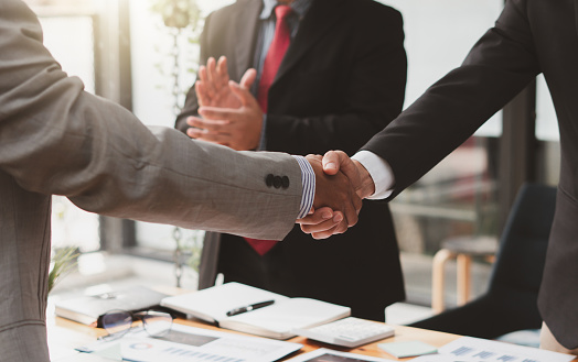 Business people shaking hands, finishing up a meeting