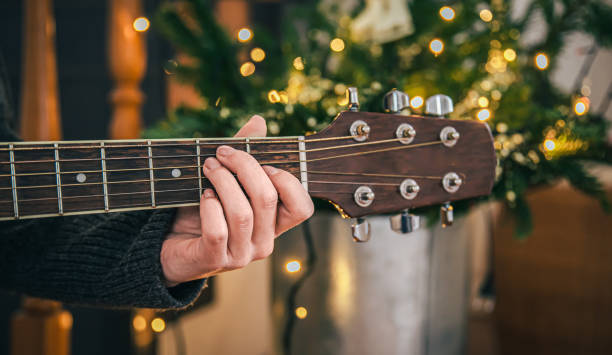 istock Close up, female hands playing the guitar. 1362721899