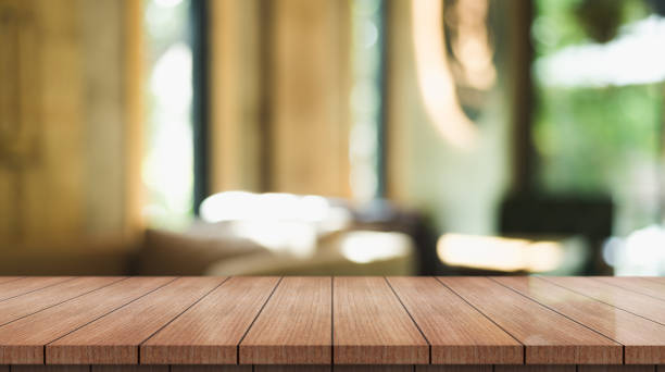 istock Empty wooden table top with lights bokeh on blur restaurant background. 1362722651