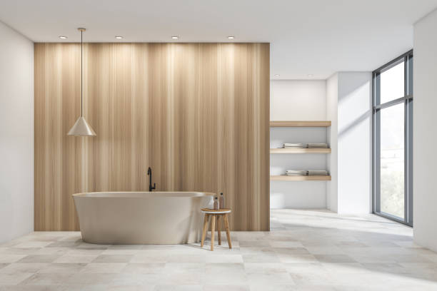 istock Bright bathroom interior with bathtub, wooden partition, panoramic window 1362723139