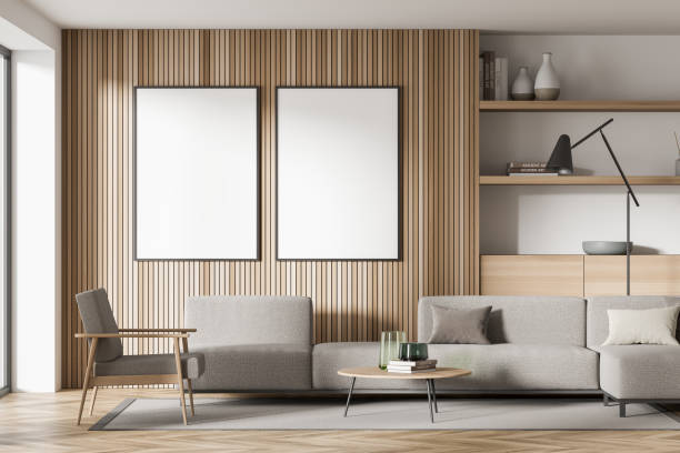 istock Light guest room interior with sofa and shelf, window and mockup posters 1362723261