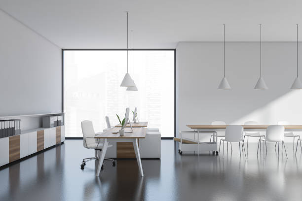 istock Side view on bright office room interior with desk, desktops 1362723491