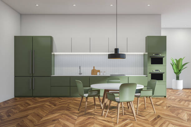 istock White and green kitchen interior with table and chairs, parquet floor and plant 1362725626