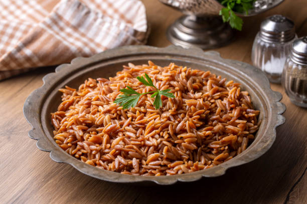 istock Traditional delicious Turkish dish, barley noodle pilaf (Turkish name; Arpa sehriye pilavi) 1362729570
