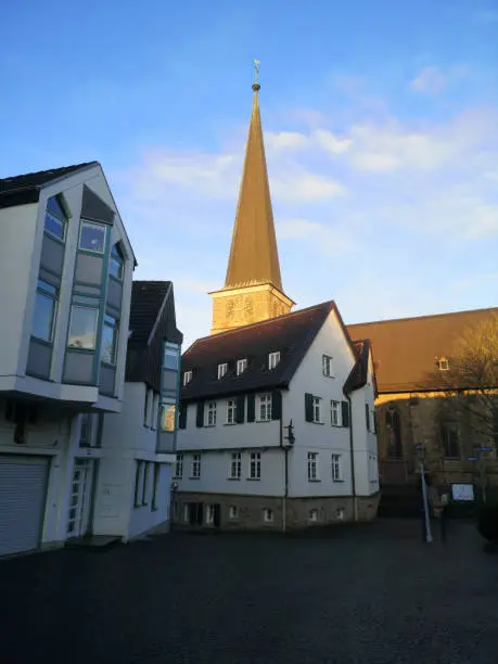 St. Peter's church (Petrikirche) in MÃ¼lheim Ruhr on a snowy day with blue sky