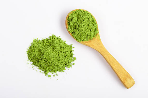 istock Top view green matcha tea powder isolated on white background 1362731493