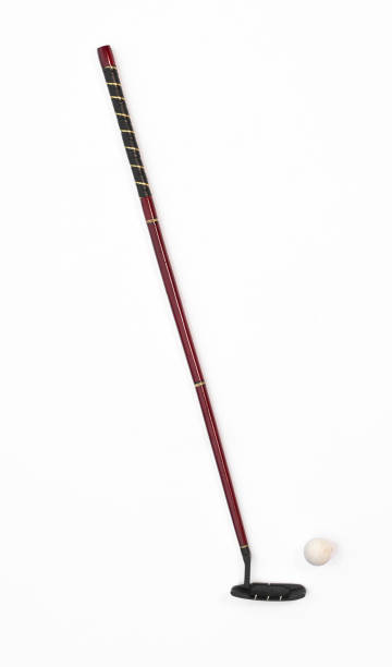 Blind person is walking on the street using a white cane to navigate the urban environment