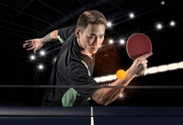 istock Man playing tennis on dark background 1362733061