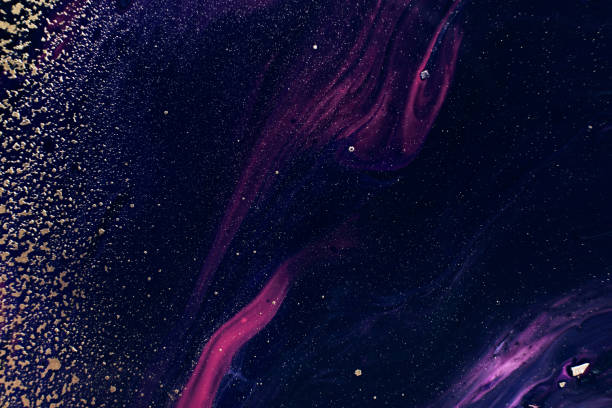 istock Fluid Art. Golden metallic particles and purple black waves. Abstract space. Marble effect background or texture 1362733385