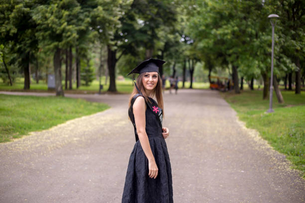 istock Excited young woman on graduation day 1362733678