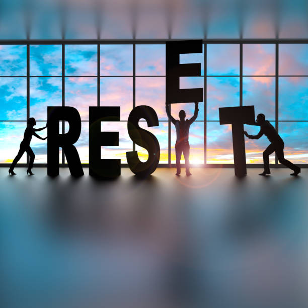 istock Business people building the word Reset. 1362735166