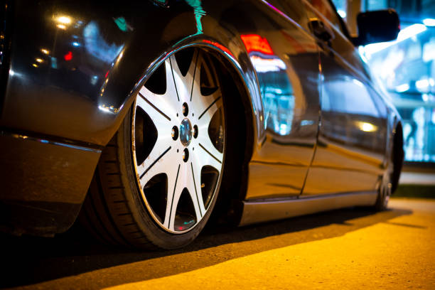 The car is parked on a night street close-up. stock photo