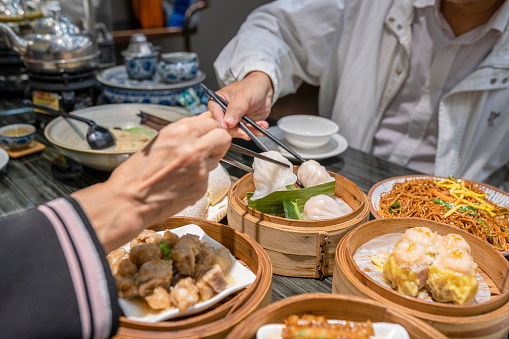 Dum sum including Shrimp Dumpling, Shumai, Honeycomb Tripes, Fried Noodles, Steamed Ribs, Fried Turnip Cake, Peach Gum Egg Tart, Cheesecake in the restaurant in Guangzhou, Guangdong.