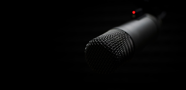 Background with a professional microphone and copy space