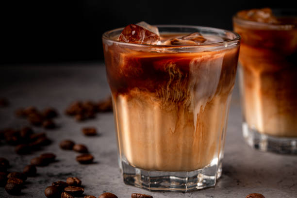 istock Ice coffee in a glass with cream poured over 1362739164