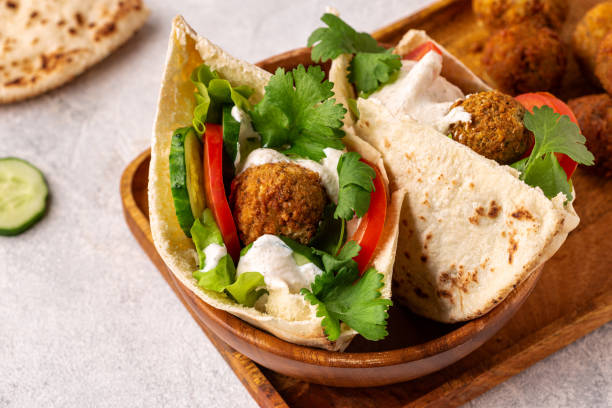 istock Falafel and fresh vegetables in pita bread 1362739197