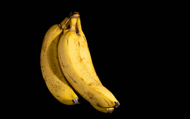 istock yellow ripe bananas over black background 1362739543