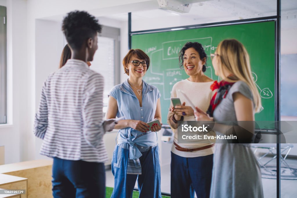 Businesswomen working together Teacher Stock Photo