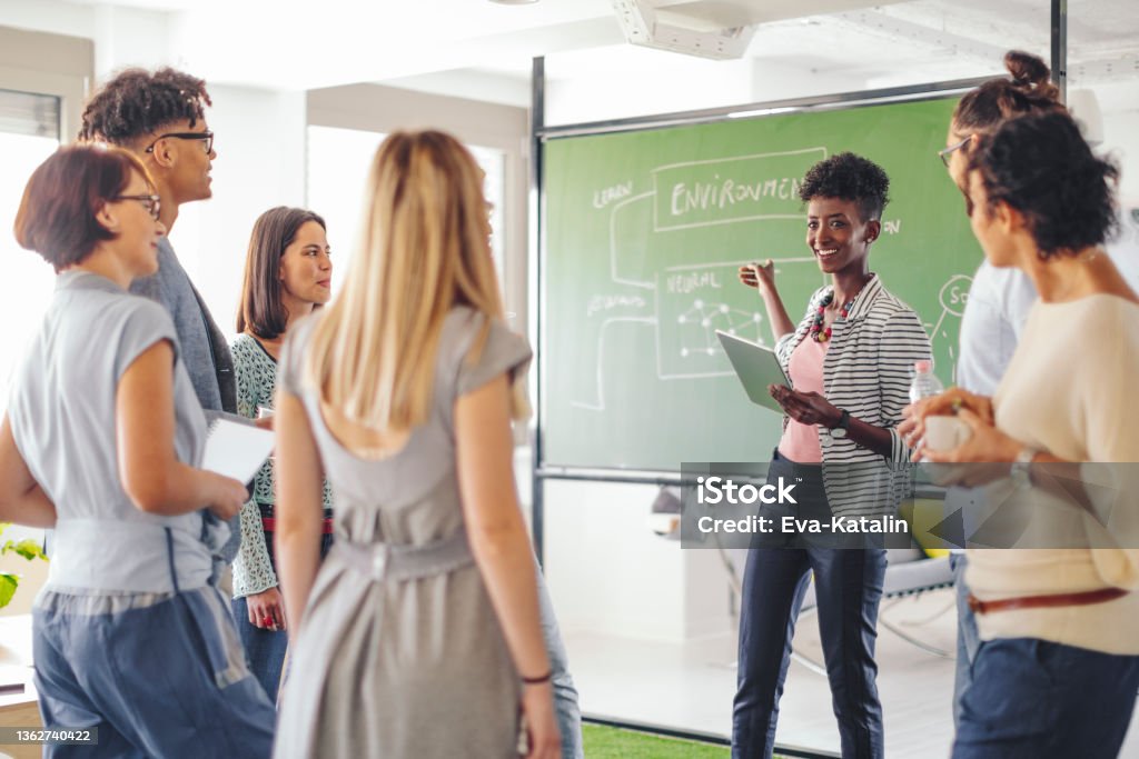 Business team working together Teacher Stock Photo