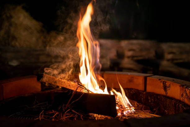 istock fire and flames. Flames and burning sparks close up, fire patterns. flames from the fire. Night bonfire, logs are on fire, sparks fly.soft focus.