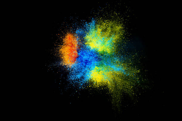 istock Explosion of colored, fluid and neoned powder on black studio background with copy space. Magazine cover, wallpaper design 1362740889