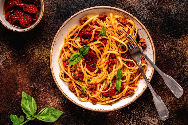 istock Pasta with bolognese sauce and sun-dried tomatoes 1362742102