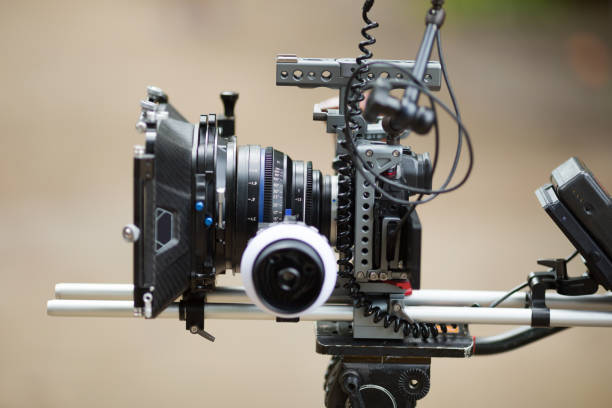 istock Filming camera on tripod outdoors 1362746502