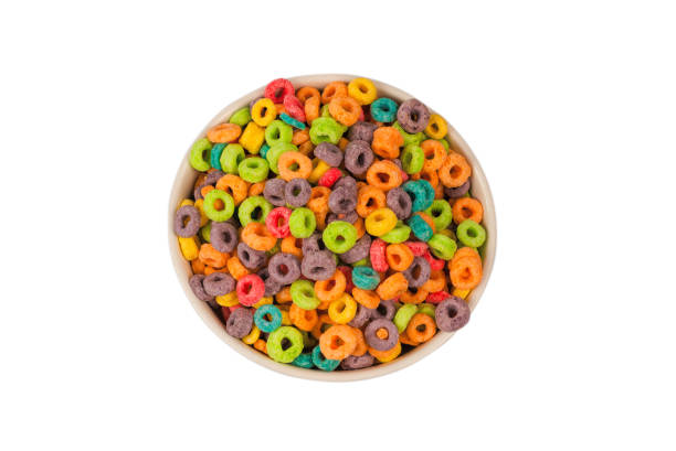 istock Colorful rings cereal spill out into a bowl. Breakfast. Isolated. 1362746765