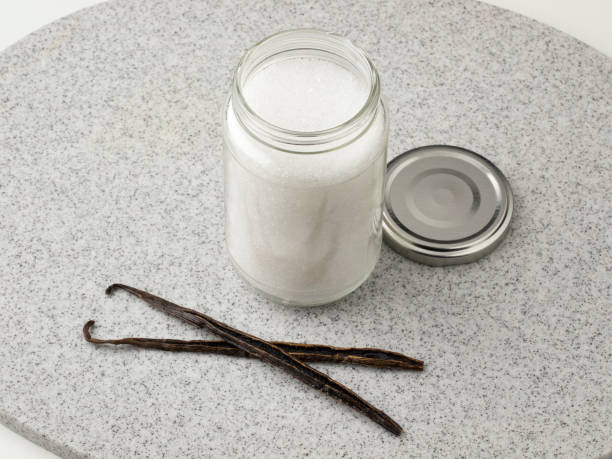 istock Pair vanilla sticks in front of a glaas jar with sugar 1362748173