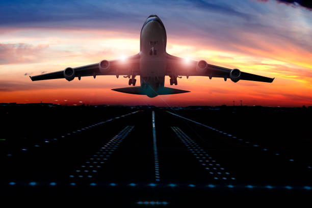 istock Passenger airplane taking of at sunrise 1362749717