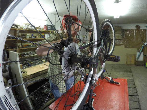 istock Handywoman repairing bicycle 1362753777