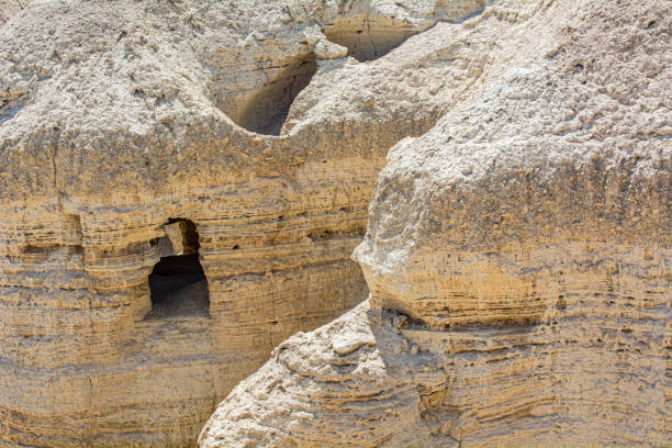 Caves of Qumran Qumran is an archaeological site in the West Bank. It is located on a dry marl plateau about 1.5 km (1 mi) from the northwestern shore of the Dead Sea, near the Israeli settlement and kibbutz of Kalya. dead sea scrolls stock pictures, royalty-free photos & images