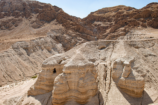 Qumran is an archaeological site in the West Bank. It is located on a dry marl plateau about 1.5 km (1 mi) from the northwestern shore of the Dead Sea, near the Israeli settlement and kibbutz of Kalya.