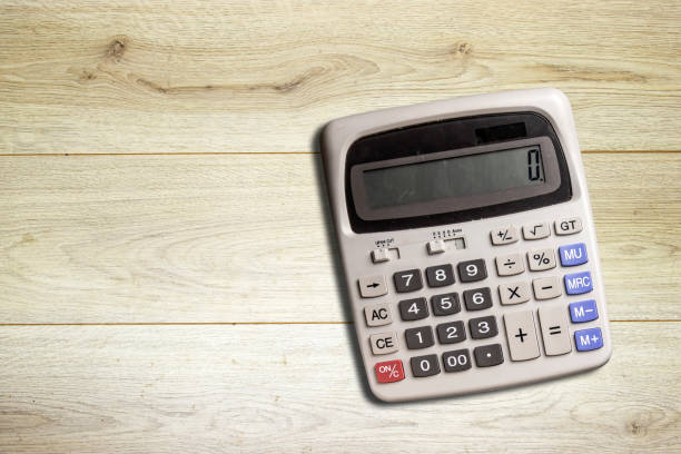 istock gray big calculator isolated on wood table 1362757433