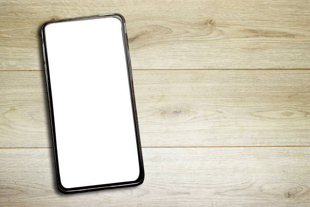 istock Mobile smartphone  on wooden table 1362758071