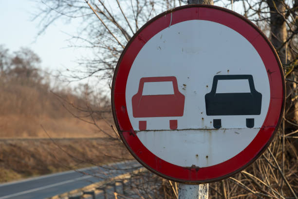istock No overtaking. Prohibited to advance indicating. Round red traffic sign 1362758750
