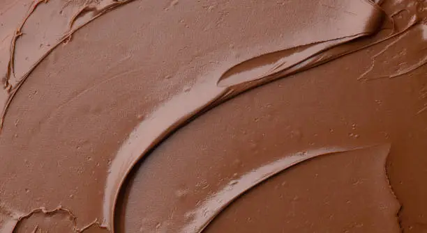 melted chocolate cream  background, top view