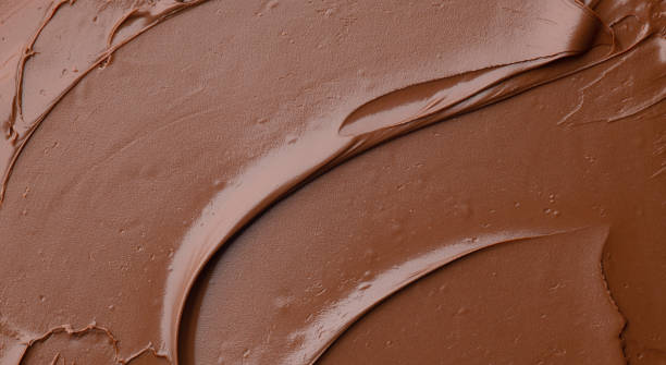 fundo de chocolate derretido - chocolate closeup - fotografias e filmes do acervo
