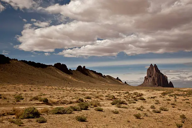 Shiprock rises over 1500 feet from its base in northwest New Mexico and is considered a sacred peak by the Navajo.  The peak is the throat of an extinct volcano. Geologic formations such as Shiprock are scattered through the southwest USA and are especially prevalent in the Four Corners region, which is made up of Colorado, New Mexico, Arizona, and Utah.  Visitors from all over the world are drawn to this area because of the unique landscapes.
