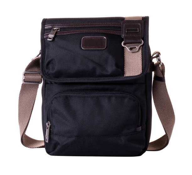 istock Black textile messenger bag for men. Wide shoulder strap in beige color. On a white background 1362764980