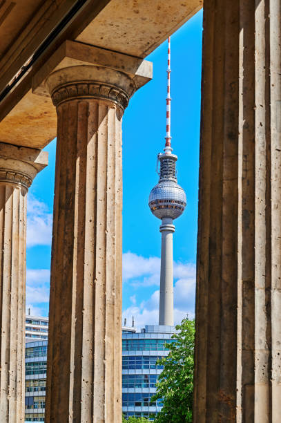View through historic arcades to the Berlin TV tower. Berlin, Germany - April 26, 2020: View through historic arcades on Museum Island in Berlin, Germany, to the TV tower at Alexanderplatz. historical museum stock pictures, royalty-free photos & images