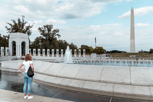 Tourist is visiting National World War II Memorial in Washington DC, USA.