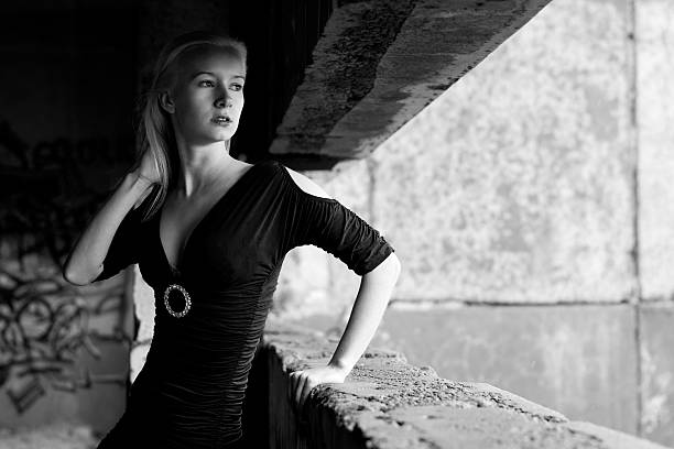 istock Young woman posing near window 136276641