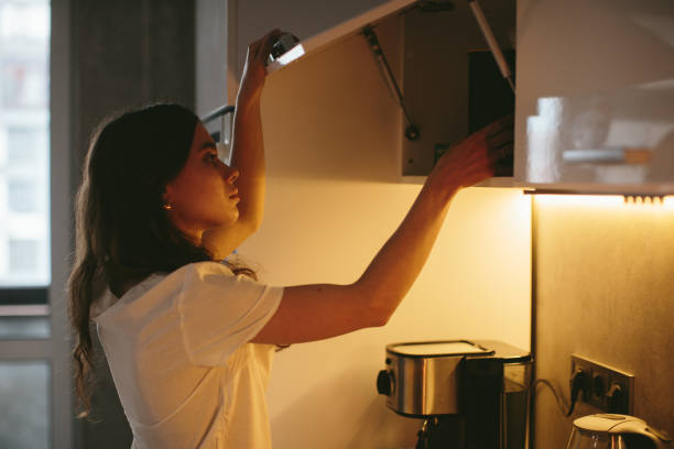 istock Young woman making morning coffee in the kitchen. 1362766917
