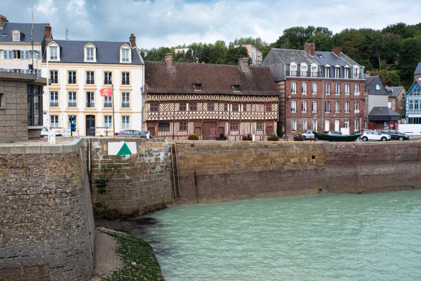 Traditional coastline house in Brittany, France, with the sea in the background.