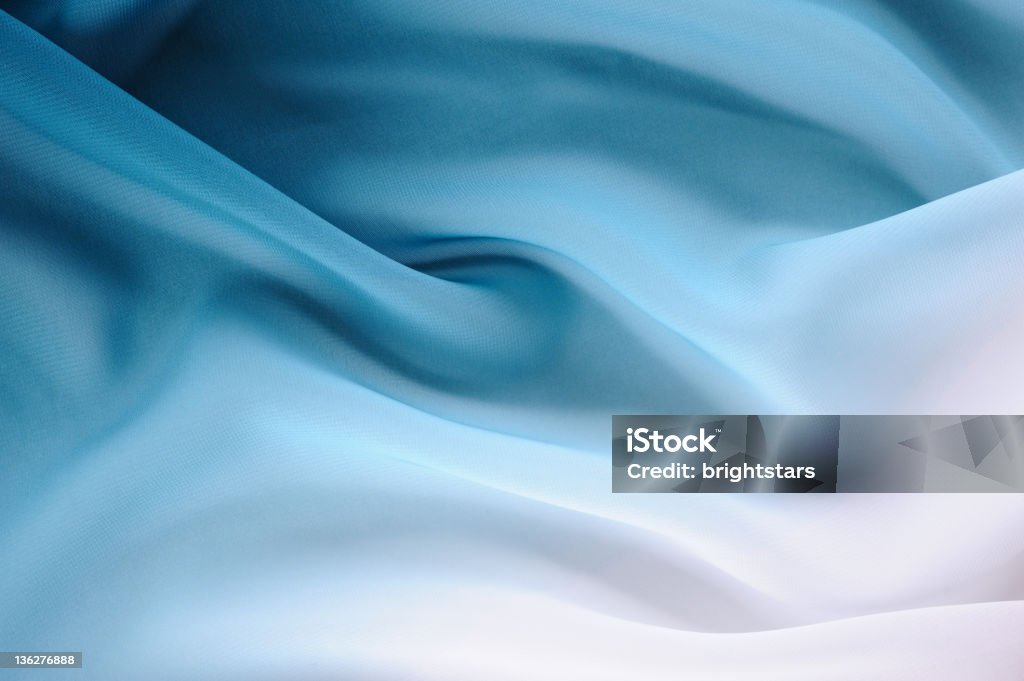 Si è laureato in seta blu e bianco - Foto stock royalty-free di Materiale tessile