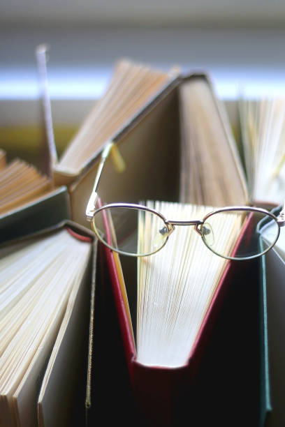 istock Hardcover Books and Reading Glasses 1362772392